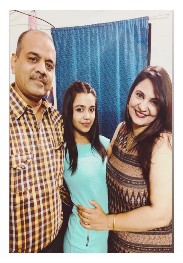with her parents